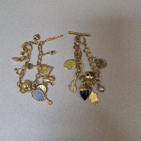 TWO CHARM GOLD BRACELETS. - Picture 1 of 2